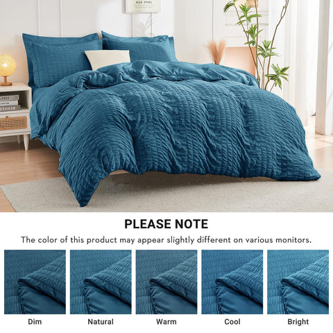HYMOKEGE Teal comforter close-up showcases soft microfiber and cloud-like warmth.