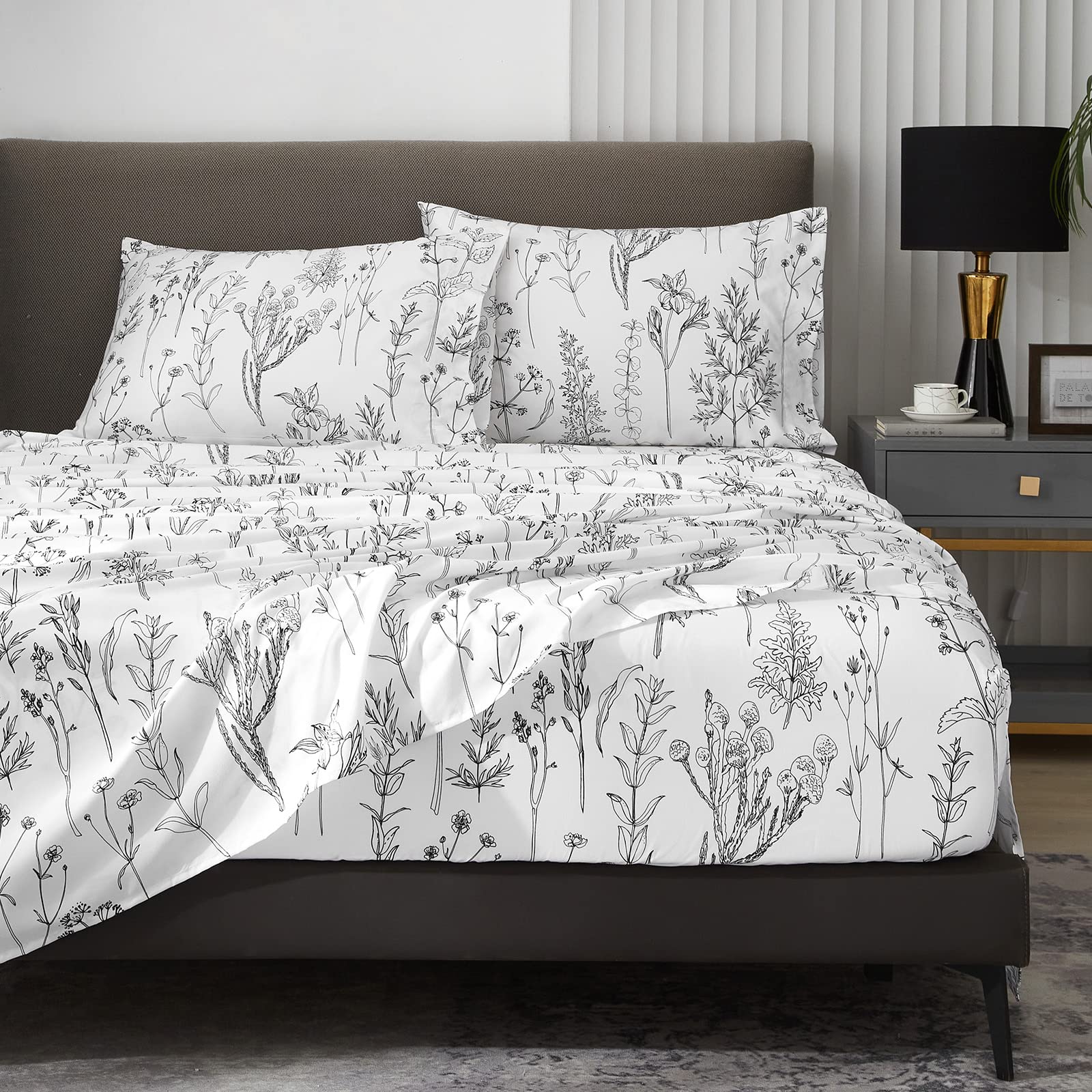 HYPREST floral sheets queen setup shows elegant white and black leaf print.