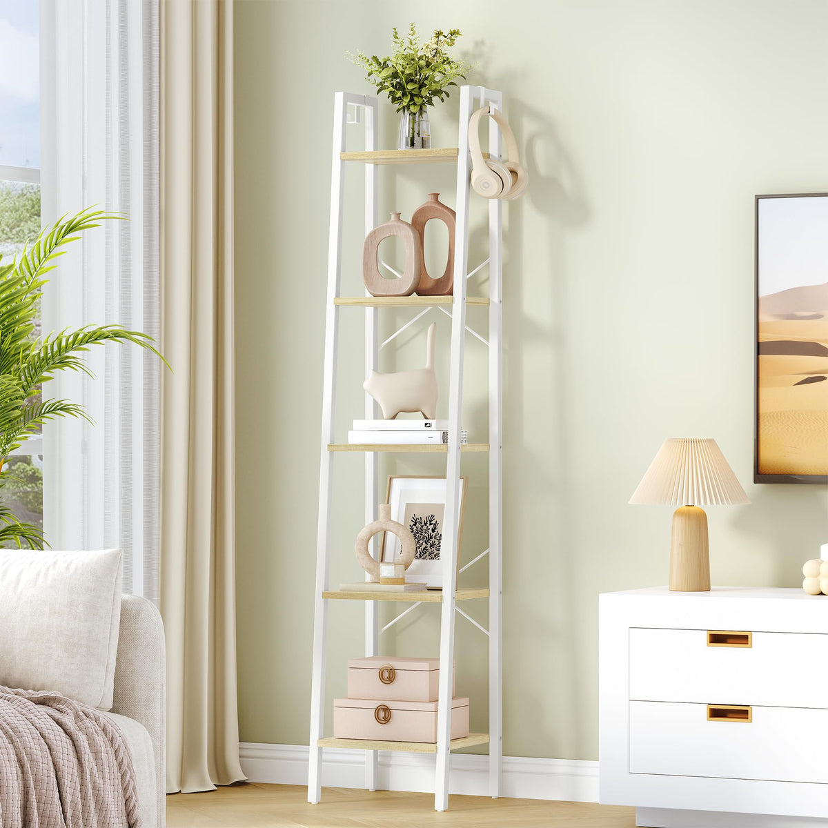 Hzuaneri ladder shelf in white oak shows tall storage for books and decor.