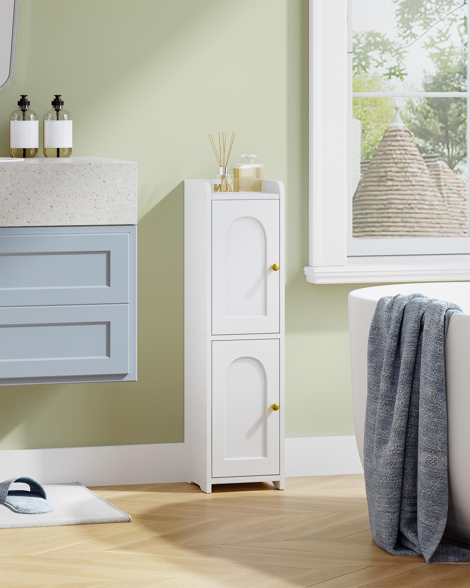 Hzuaneri narrow corner cabinet with arched doors fits small bathrooms.