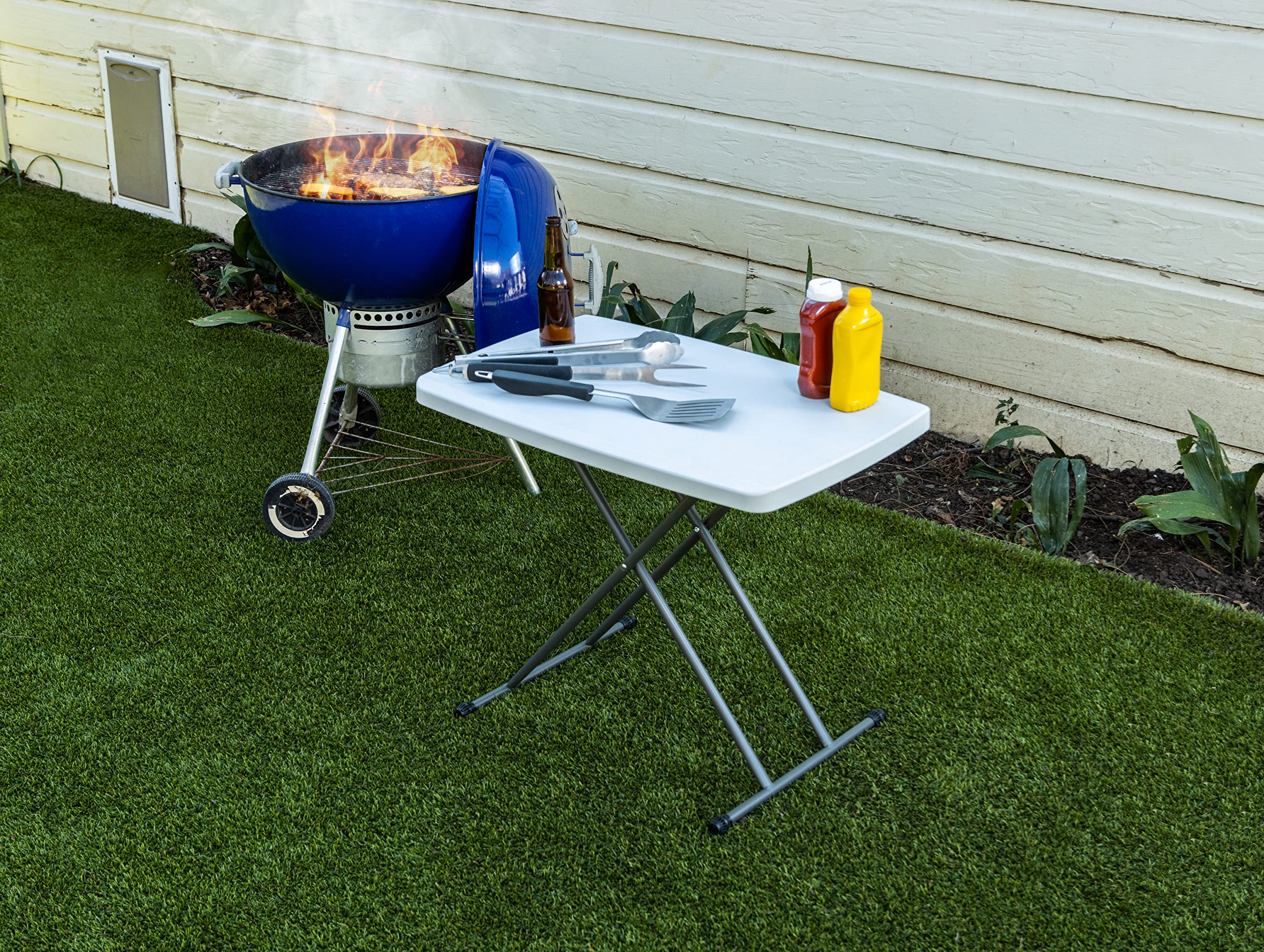 Iceberg folding table multipurpose use as coffee table or laptop desk.