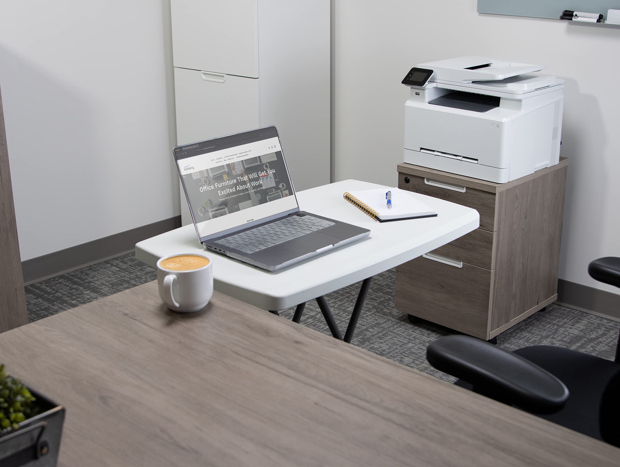 Iceberg portable folding table stored in compact living space.