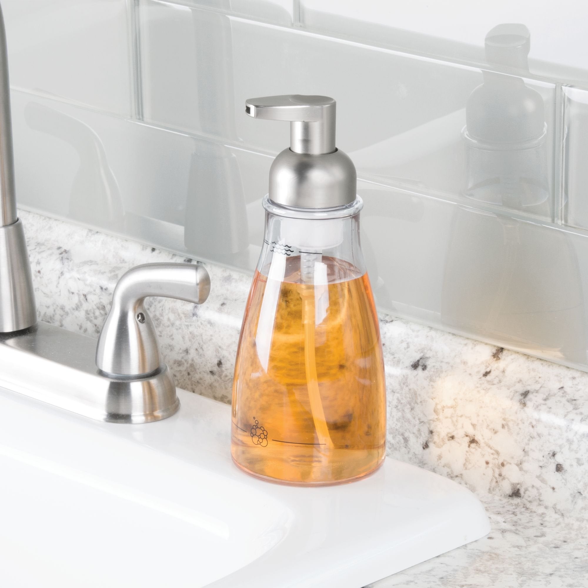 Close-up of iDesign foaming soap dispenser brushed nickel pump