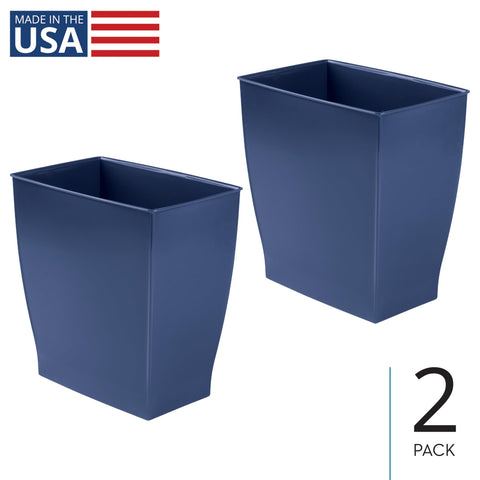 iDesign Mono trash can in navy blue beside a desk for a clutter-free workspace.