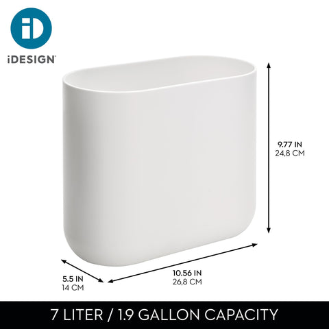 iDesign slim trash can beside the bed keeps small messes organized