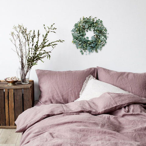 Idyllic 22-inch Eucalyptus Wreath creates elegant wedding background decor.