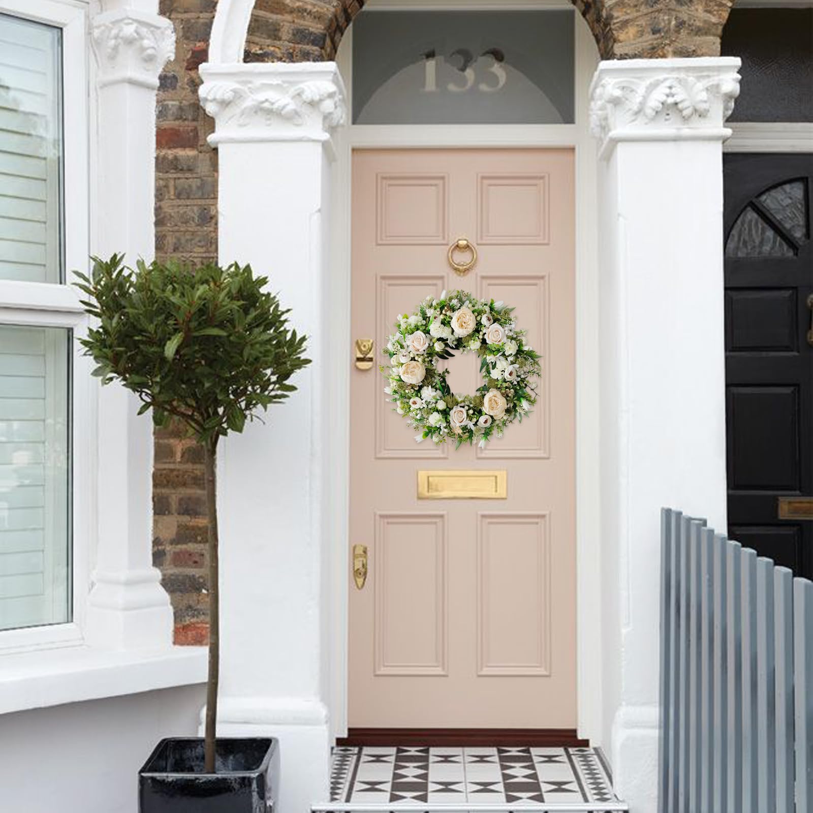 Idyllic wreath outdoor porch adds color resistant to seasonal weather.