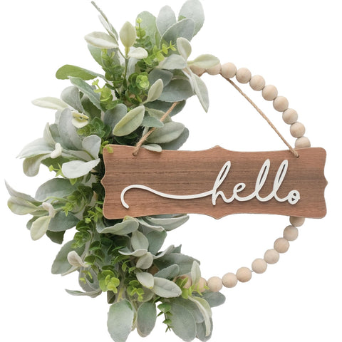 Idyllic green wreath for front door with wood beads and delicate lambs ears leaves, ideal for seasonal charm.