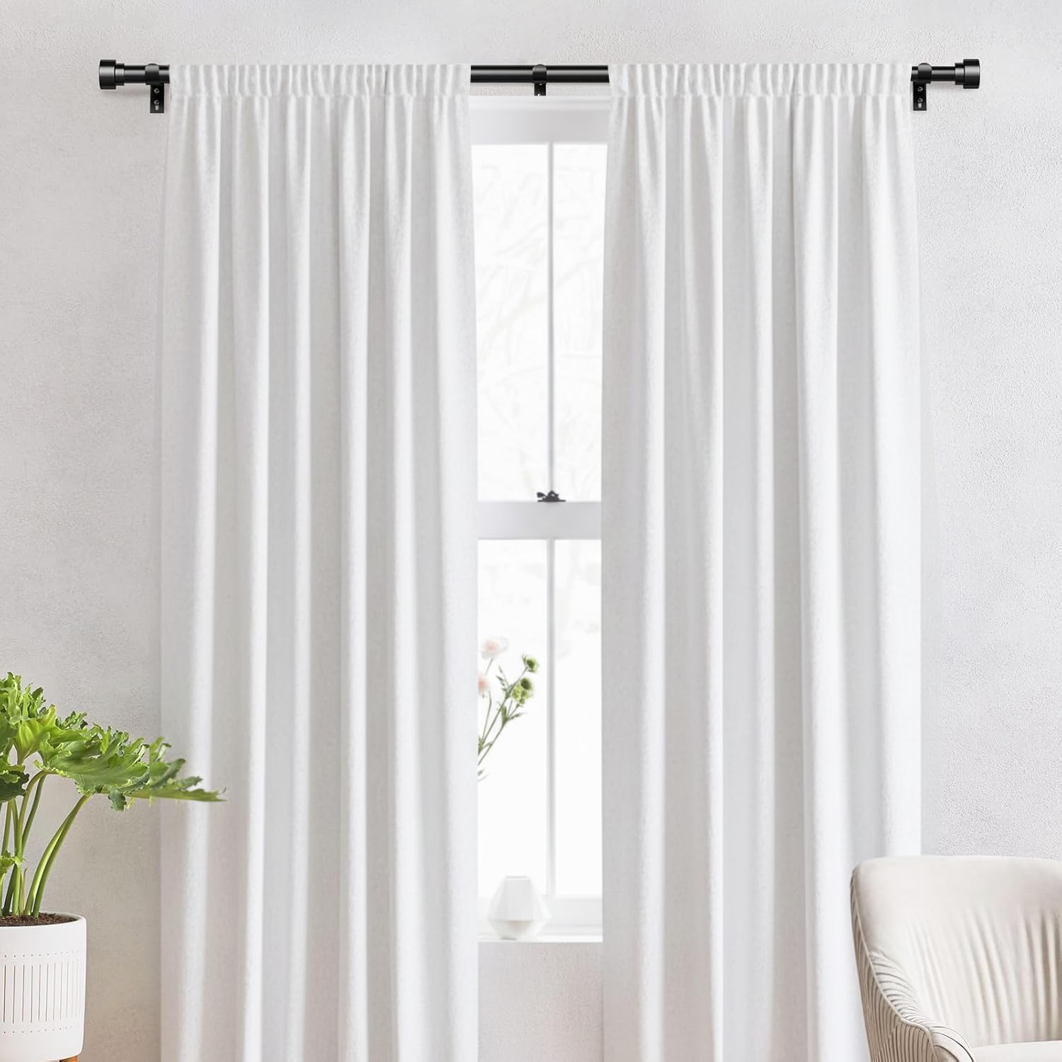 IFELS curtain rod with matte black finish mounted on wall for modern decor.