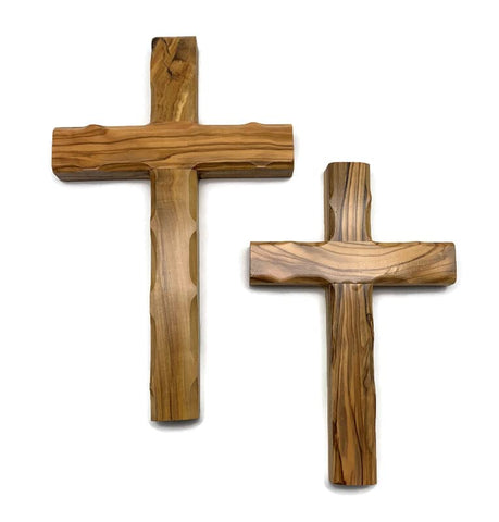 iHoly Land Crafts olive wood cross from Bethlehem hung on wall, warm and inviting.