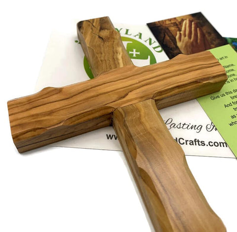 Collection of olive wood cross sizes to fit different wall spaces by iHoly Land Crafts.