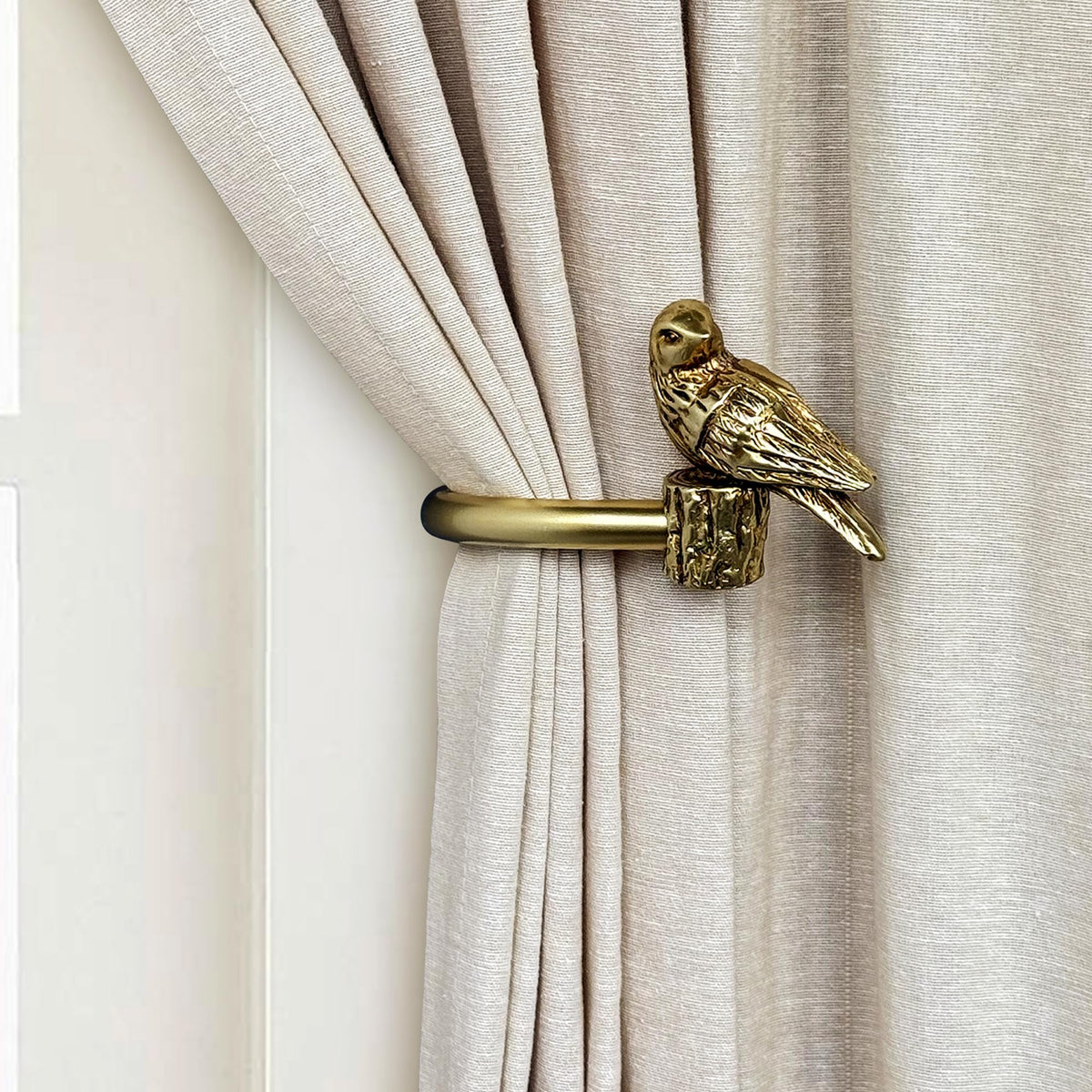 ILAISIHOME bird-design curtain holdback in gold secures drapes while adding charm.