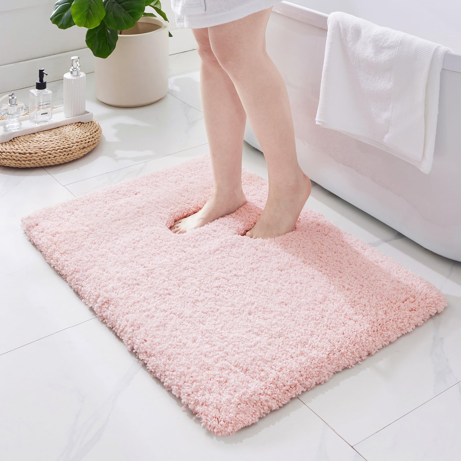 ILANGO pink bathroom rug 32x20 with non-slip surface provides stable footing.