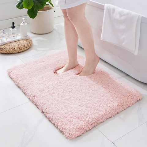 ILANGO pink bathroom rug 32x20 with non-slip surface provides stable footing.