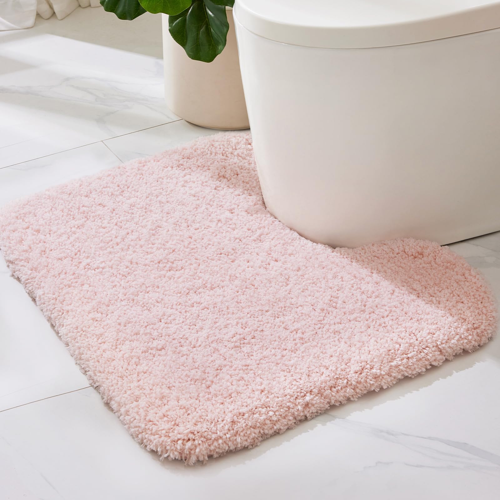 ILANGO pink toilet rug u-shape 22x24 offers soft comfort and rapid moisture absorption.