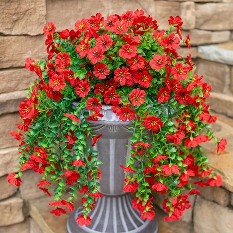 INSPRING porch decor featuring red daisies and greenery