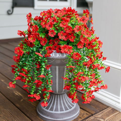 INSPRING urn display with red daisies and trailing vines