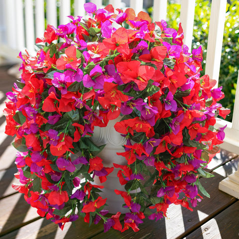 INSPRING faux bougainvillea trailing vine enhances porch greenery year‑round.