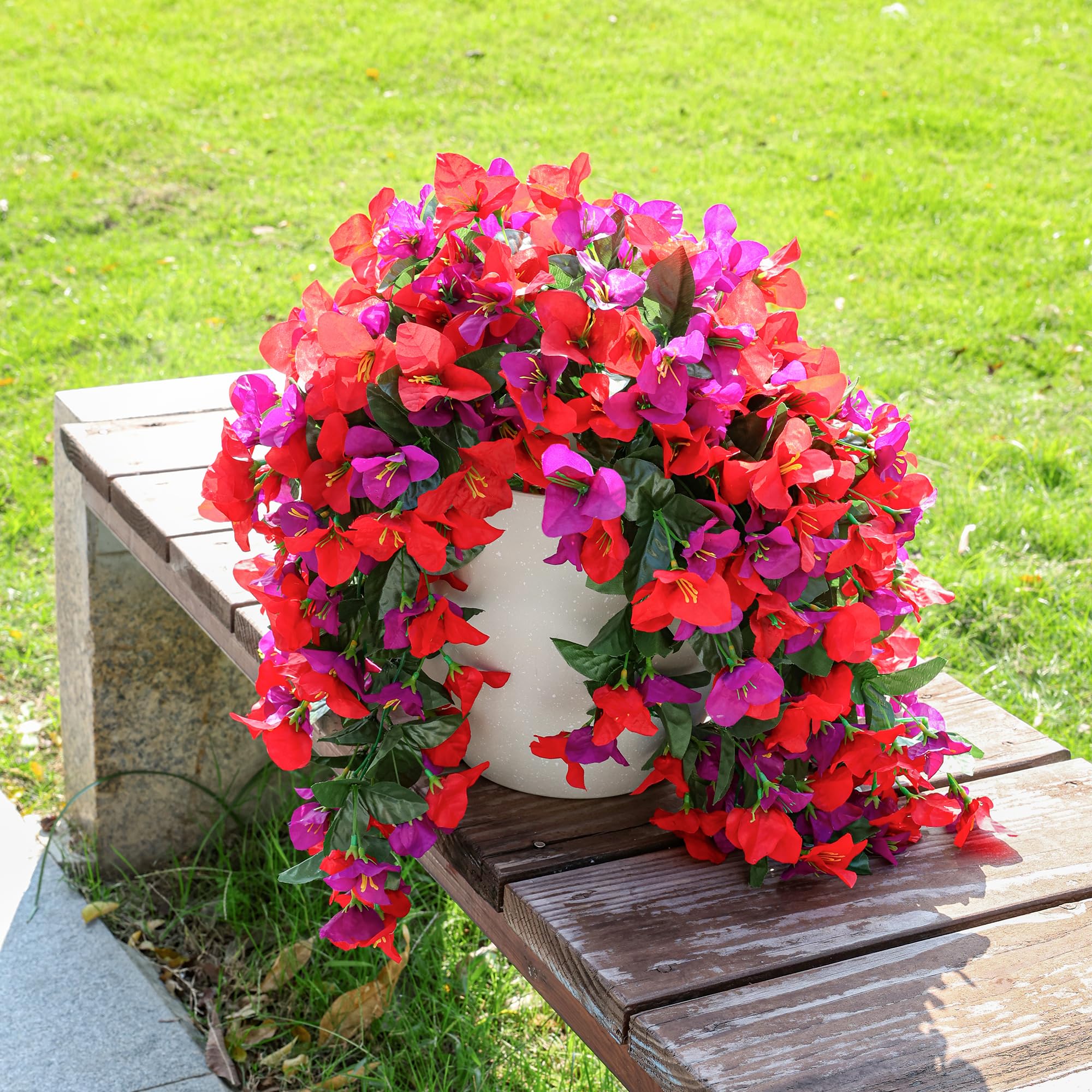 INSPRING faux bougainvillea trailing vine adds seasonal charm to gardens.
