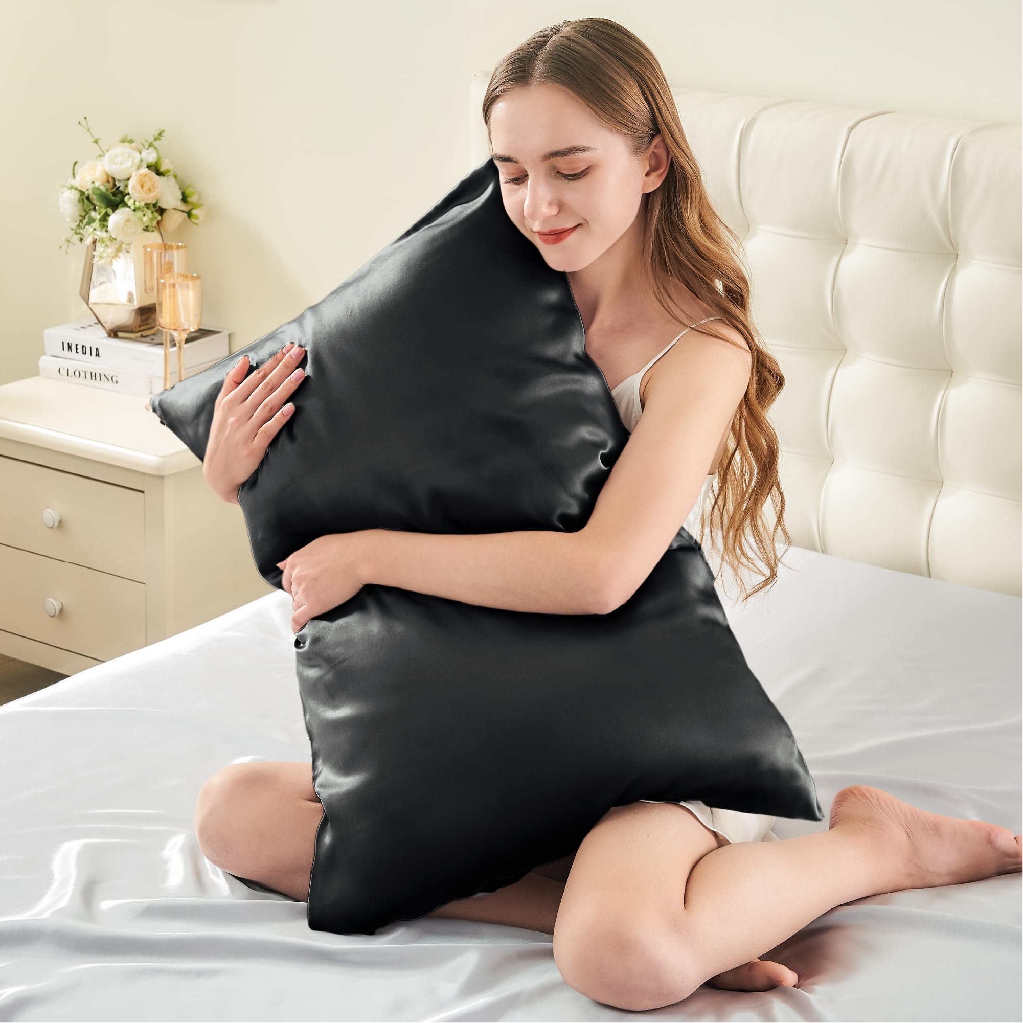 Queen size 20x30 black silk pillowcase by INFIIXSO for a luxurious bed setup.