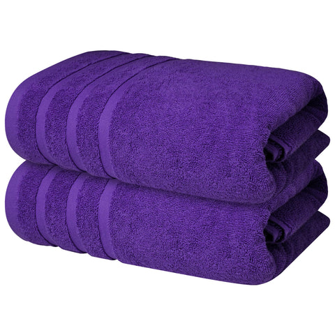 Infinitee Xclusives bath towel folded in Profound Purple for luxurious post-bath comfort