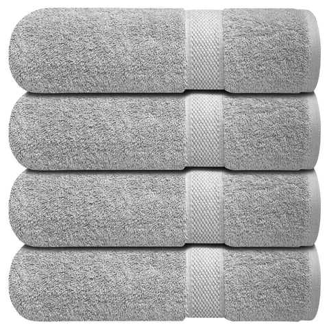 Infinitee Xclusives bath towels four-piece collection in a luxurious bathroom