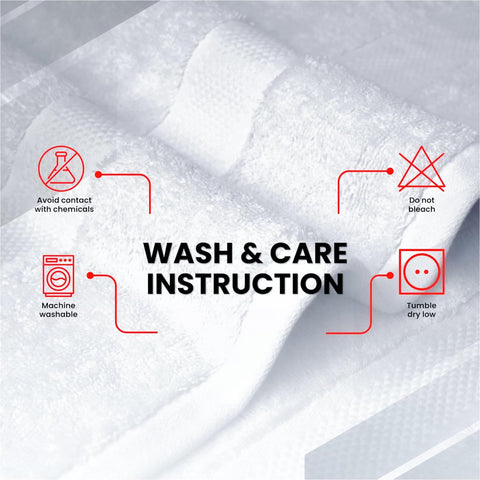 Infinitee Xclusives jumbo bath sheets draped over a towel rack in a luxury bathroom.