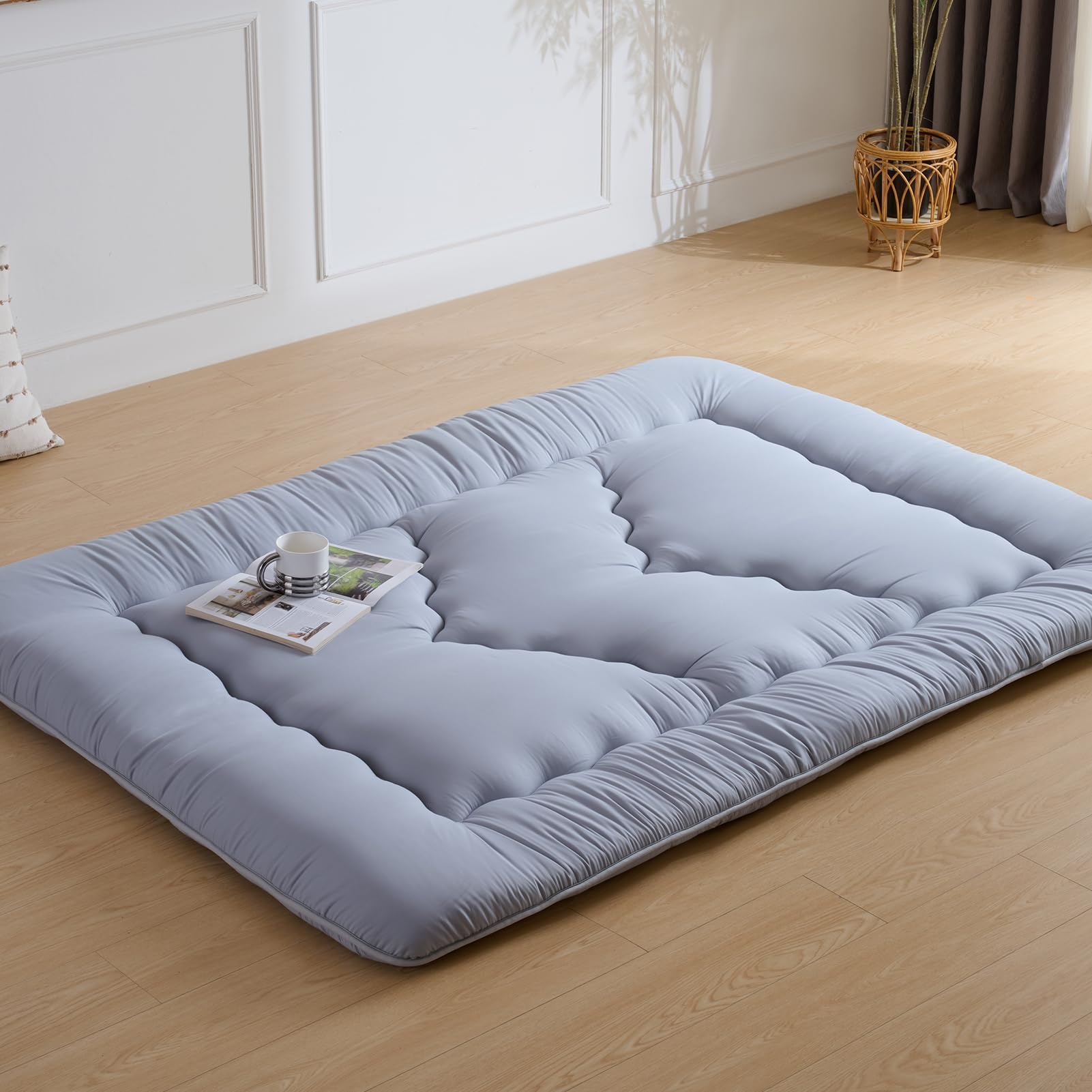 Ingdgnoso rolled mattress with straps and storage bag for portability.