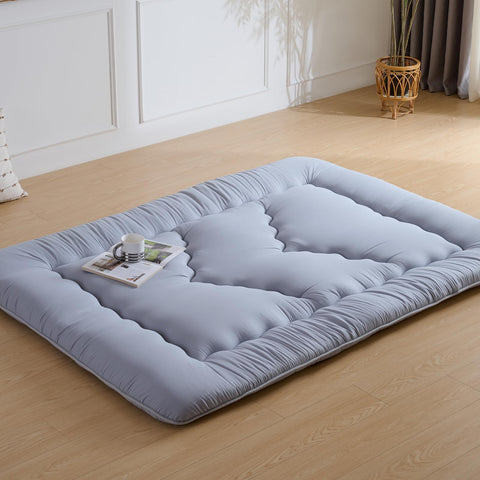 Ingdgnoso rolled mattress with straps and storage bag for portability.