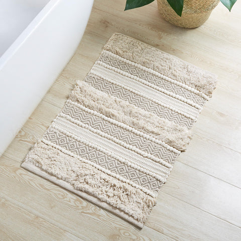 INK+IVY Asher bath rug with woven texture stripe adds chic boho style.