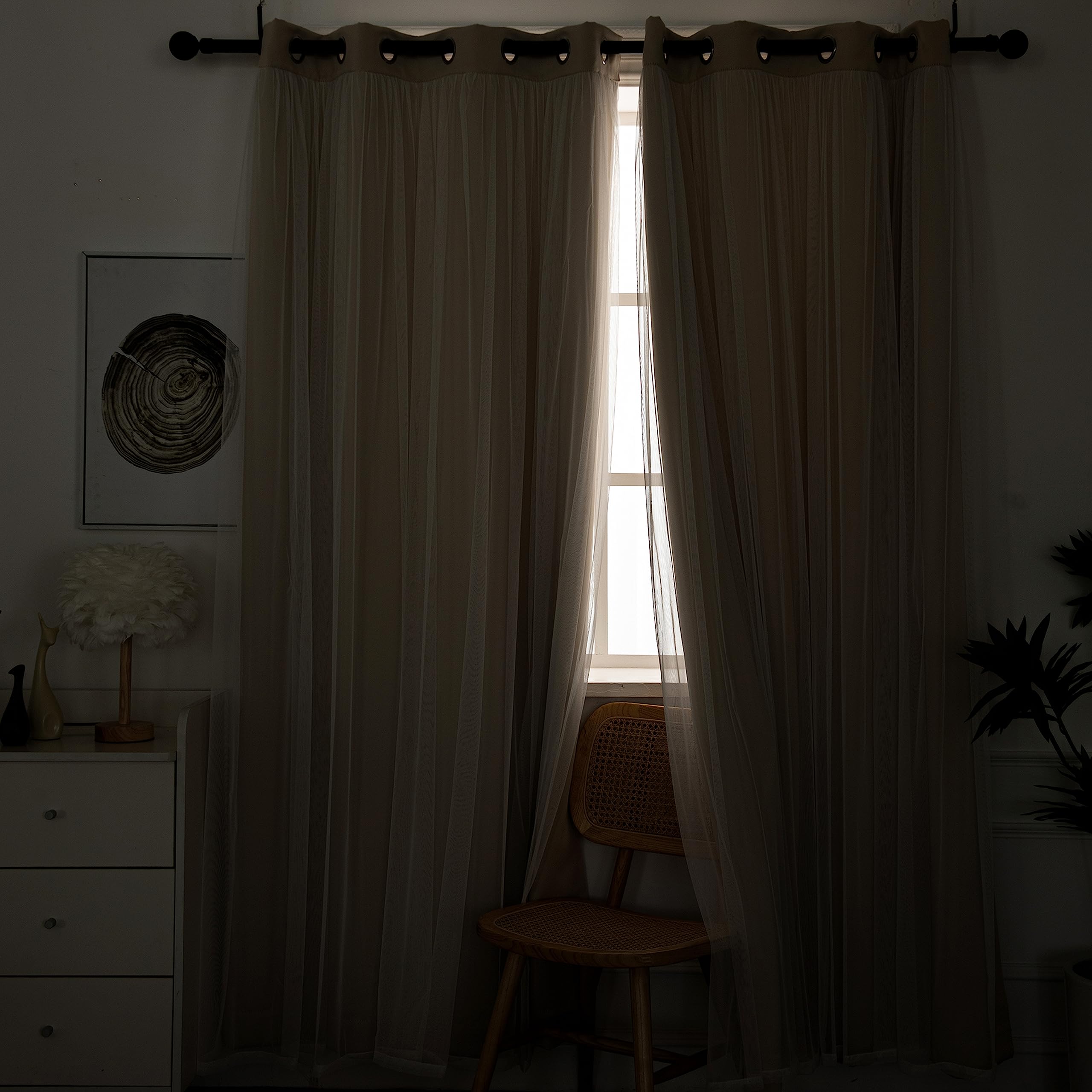 Twin-panel setup on beige curtains reveals soft natural light through sheer layer.