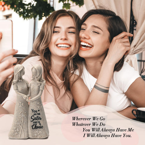 INLOMEM sister figurine dress engraving close-up highlights inscription detail.