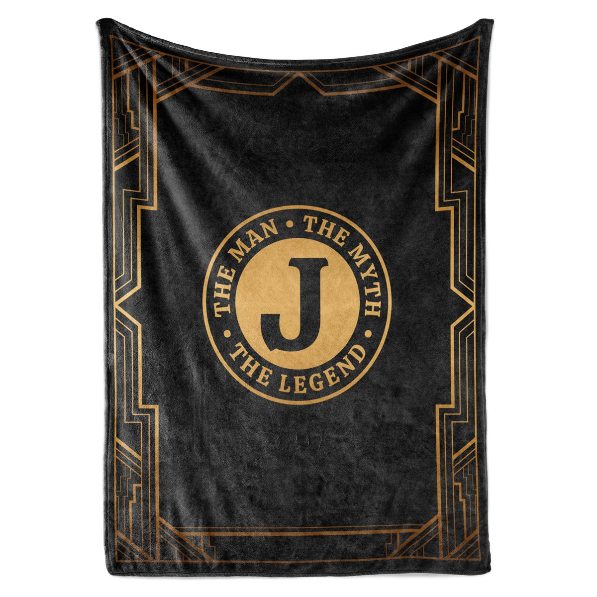 InnoBeta Legend Initial Plush Throw on sofa, cozy evenings and warm comfort.
