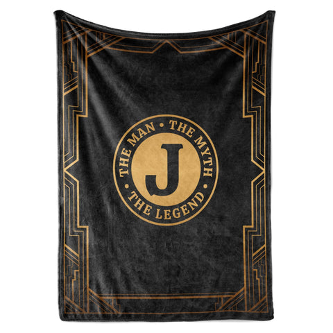 InnoBeta Legend Initial Plush Throw on sofa, cozy evenings and warm comfort.