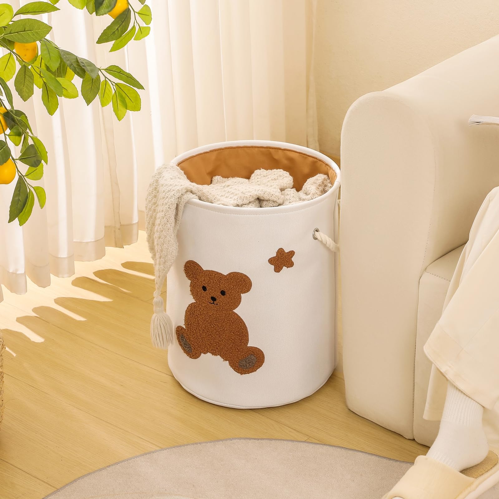 INough 42L-capacity nursery bin stores plush toys and blankets neatly.