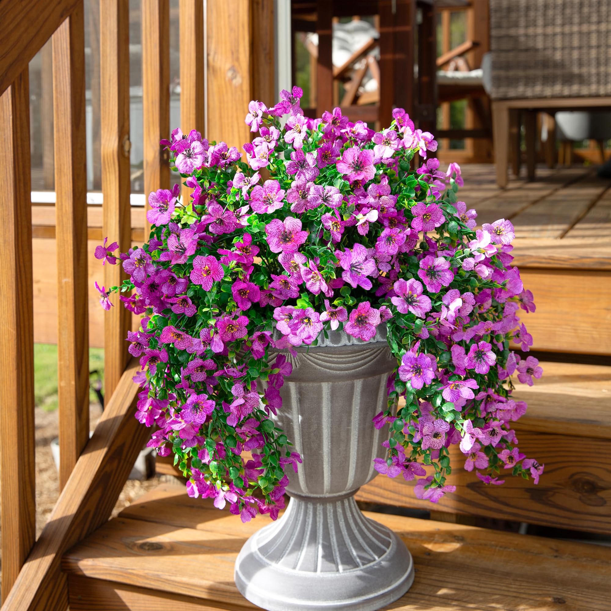 inspring UV resistant hanging flowers add year-round charm to entryways.