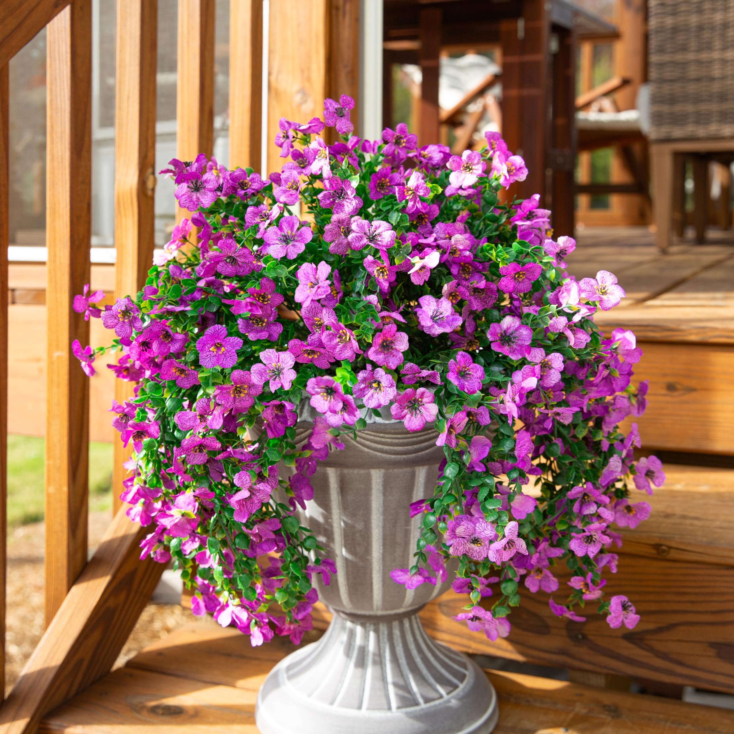 inspring durable silk and plastic blooms withstand rain and sun.
