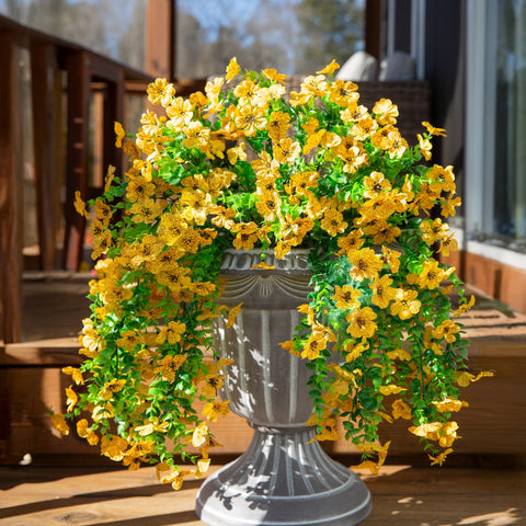 INSPRING urn planter accent with faux daisies for year-round outdoor charm
