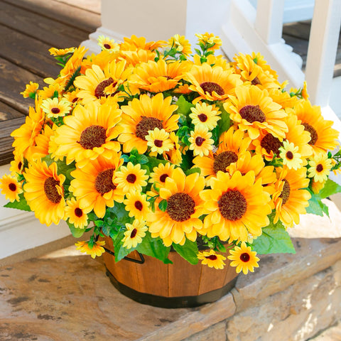 INSPRING sunflowers with green leaves add natural fullness to displays.