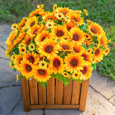 INSPRING sunflowers crafted from silk and plastic for a realistic look.