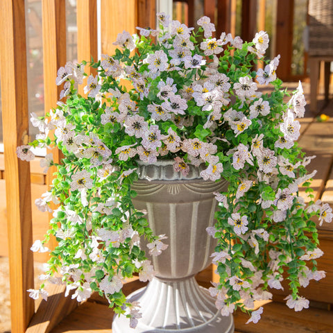 INSPRING waterproof silk flowers resist moisture for outdoor use.