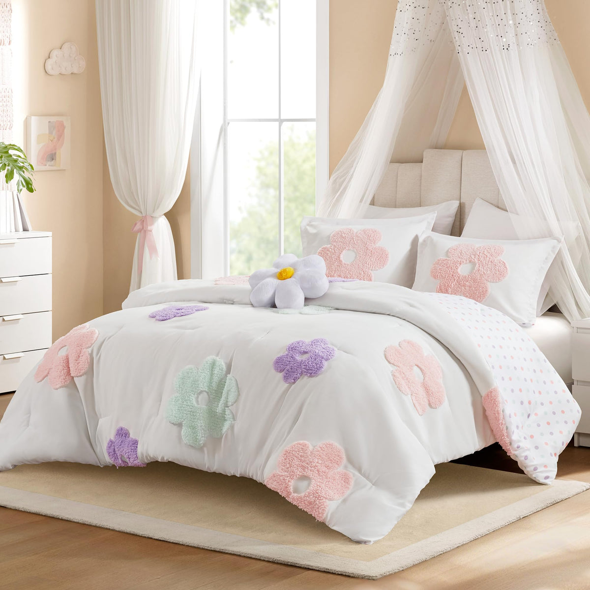Intelligent Design Gracie floral tufted chenille comforter adds vibrant color to a kid's bed.