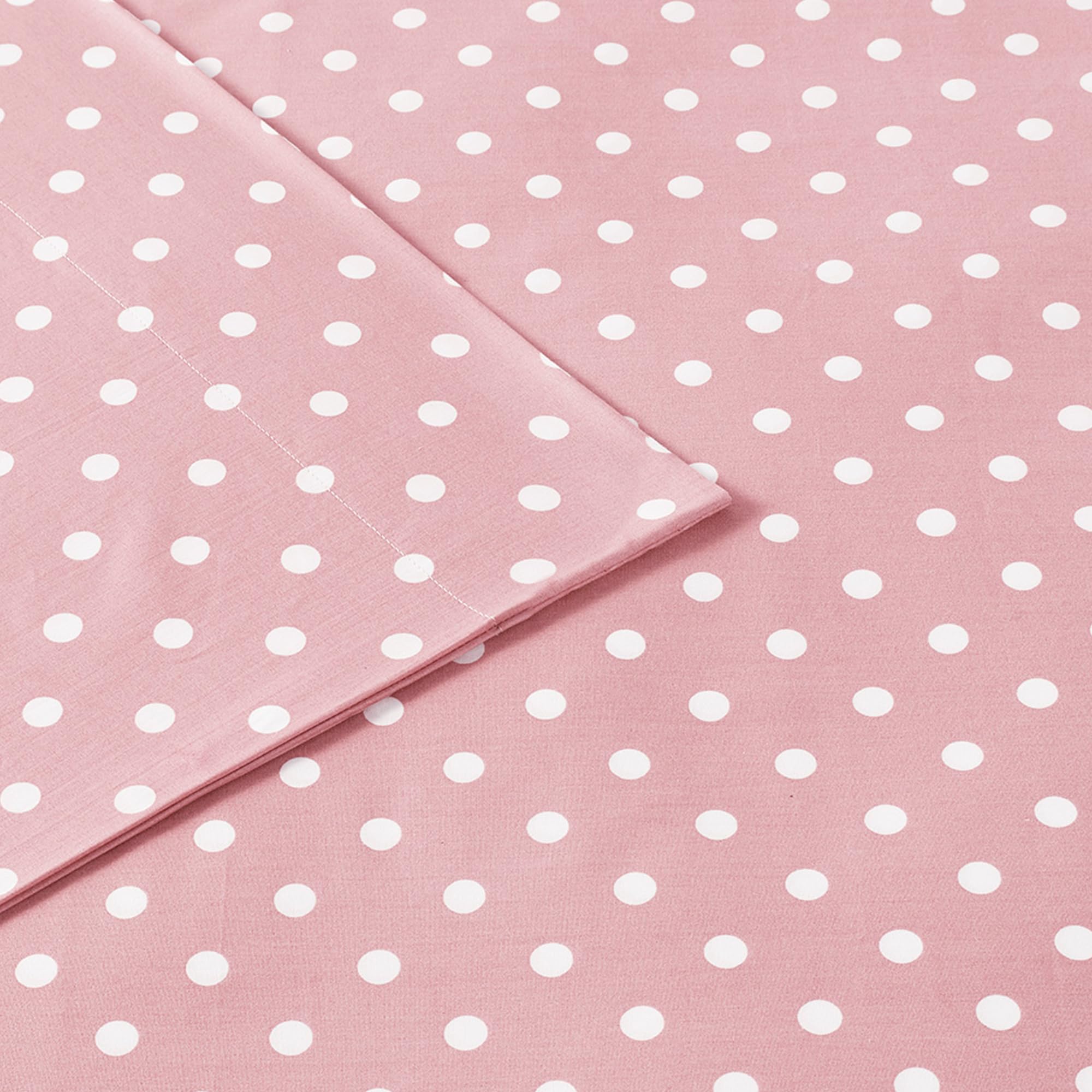 Intelligent Design pink polka-dot kids’ bedroom scene, showcasing cheerful bedding setup.