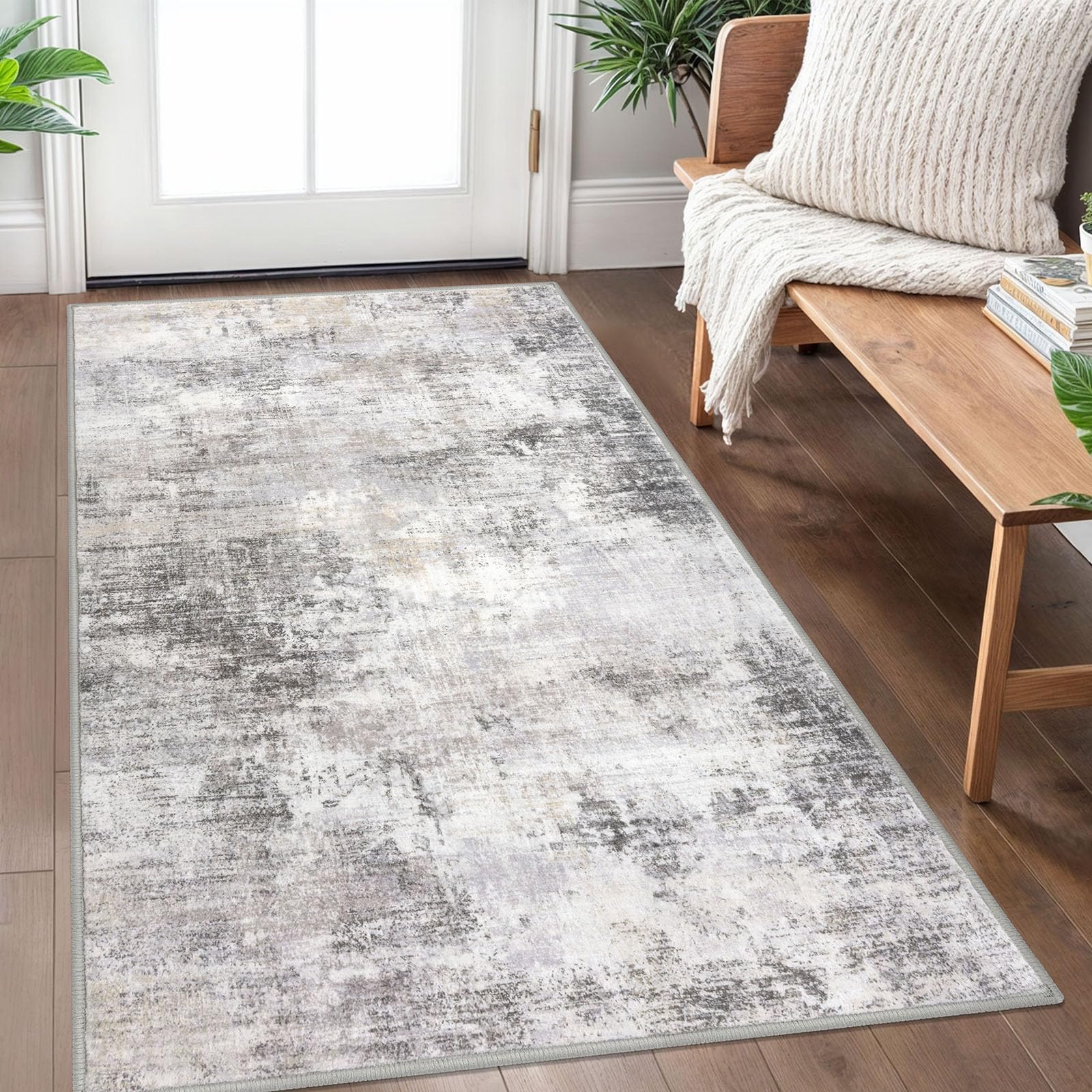 IOHOUZE abstract area rug in grey-beige enhances living spaces with modern flair.