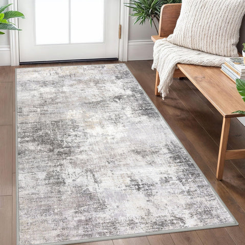 IOHOUZE abstract area rug in grey-beige enhances living spaces with modern flair.