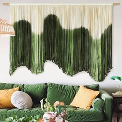 IOWER large macrame wall hanging with green dip-dyed gradient creates a calming focal point above the bed
