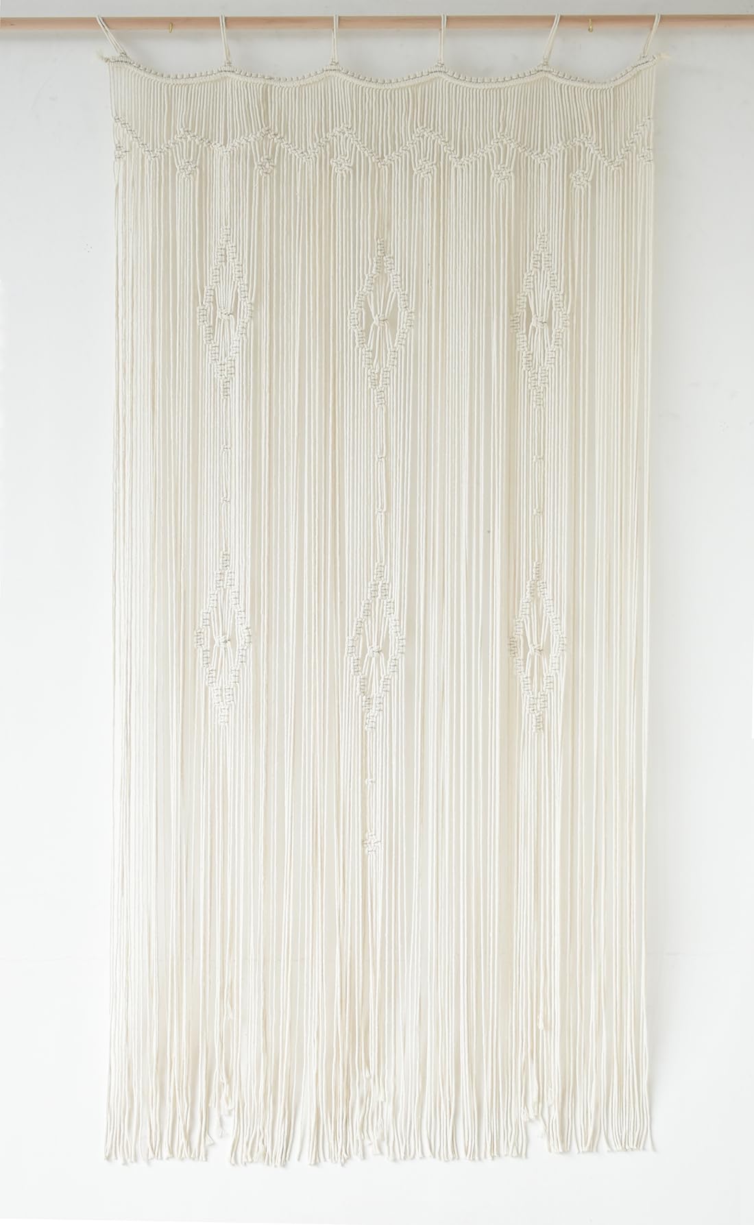IOWER macrame curtain close-up knots showcase craft and texture.