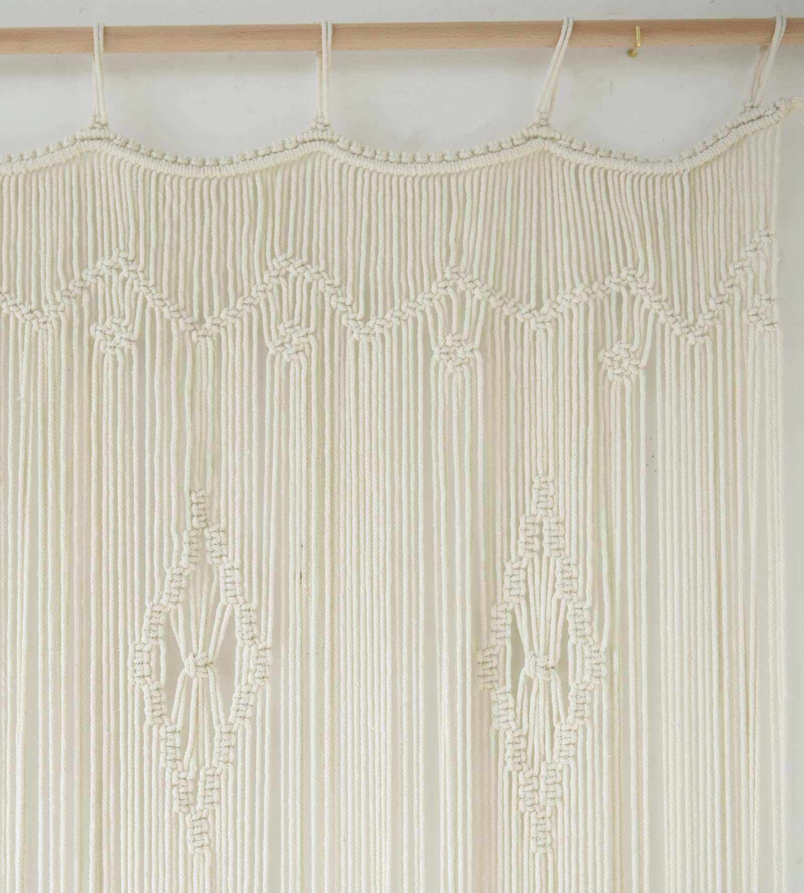 IOWER macrame curtain room divider provides subtle, stylish separation.