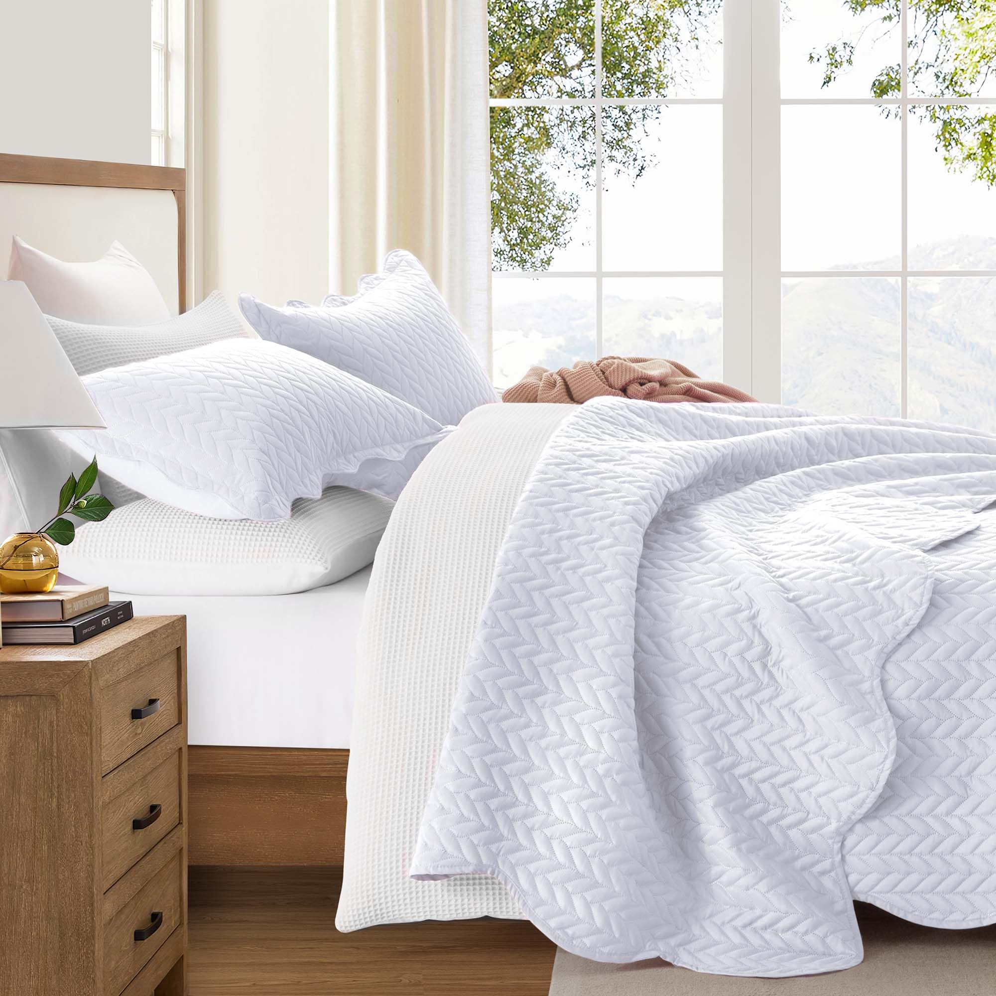 IR Imperial Rooms styled bedroom with embossed white quilt