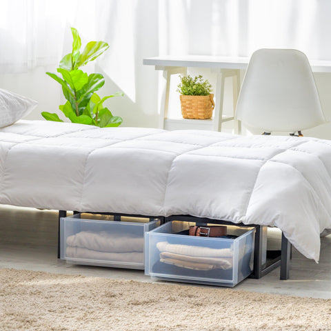 IRIS USA stackable drawer in bedroom setup keeping clothing organized.